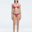 Front view of model wearing Rory Pİnk Optical Bikini Top with halterneck design and underwire support.
