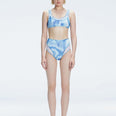 Front view of model wearing Rosalind Blue Optical Bikini Bottom with high-waisted design and two-layered tulle.
