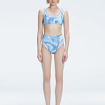 Front view of model wearing Rosalind Blue Optical Bikini Bottom with high-waisted design and two-layered tulle.
