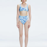 Front view of model wearing Rosalind Blue Optical Bikini Top with scoop neck and two-layered tulle design.
