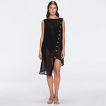 Solianne Black Sheer Sleeveless Asymmetric Dress with Gold Button Detail | Moeva | Beachwear Dresses | Each week unveils new pieces—luxury swimwear, fluid resort silhouettes, and elevated summer-to-evening essentials designed to carry you from coastal escapes to city nights.