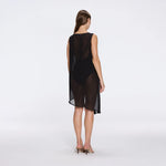 Solianne Black Sheer Sleeveless Asymmetric Dress with Gold Button Detail | Moeva | Beachwear Dresses | Each week unveils new pieces—luxury swimwear, fluid resort silhouettes, and elevated summer-to-evening essentials designed to carry you from coastal escapes to city nights.