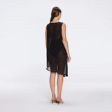 Solianne Black Sheer Sleeveless Asymmetric Dress with Gold Button Detail | Moeva | Beachwear Dresses | Each week unveils new pieces—luxury swimwear, fluid resort silhouettes, and elevated summer-to-evening essentials designed to carry you from coastal escapes to city nights.
