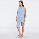 Solianne Blue Sheer Sleeveless Asymmetric Dress with Gold Button Detail | Moeva | Beachwear Dresses | Each week unveils new pieces—luxury swimwear, fluid resort silhouettes, and elevated summer-to-evening essentials designed to carry you from coastal escapes to city nights.