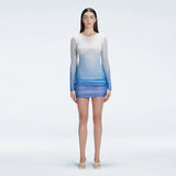 Sylvie Blue Optical Long Sleeve Mini Dress | Moeva | Beachwear Dresses | Each week unveils new pieces—luxury swimwear, fluid resort silhouettes, and elevated summer-to-evening essentials designed to carry you from coastal escapes to city nights.
