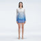 Sylvie Blue Optical Long Sleeve Mini Dress | Moeva | Beachwear Dresses | Each week unveils new pieces—luxury swimwear, fluid resort silhouettes, and elevated summer-to-evening essentials designed to carry you from coastal escapes to city nights.