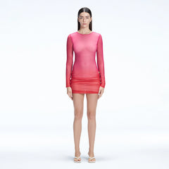 Sylvie Pink Optical Long Sleeve Mini Dress | Moeva | Beachwear Dresses | Each week unveils new pieces—luxury swimwear, fluid resort silhouettes, and elevated summer-to-evening essentials designed to carry you from coastal escapes to city nights.