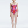 Front view of model wearing Seraphina Red Optical One Piece with scoop neck and boned torso for support.
