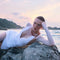 Model wearing the Breena White Swimsuit paired with the Ephram White Skirt, featured in Sober Magazine.
