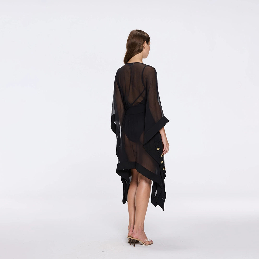 Tata Black Sheer Gold Buttoned Belted Kaftan with Asymmetric Hem | Moeva | Kaftans | Each week unveils new pieces—luxury swimwear, fluid resort silhouettes, and elevated summer-to-evening essentials designed to carry you from coastal escapes to city nights.