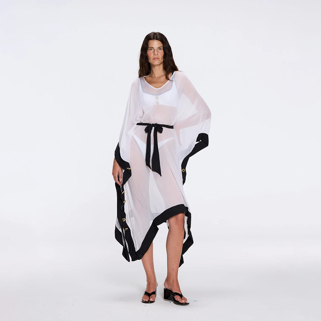 Tata White-Black Sheer Gold Buttoned Belted Kaftan with Asymmetric Hem | Moeva | Kaftans | Each week unveils new pieces—luxury swimwear, fluid resort silhouettes, and elevated summer-to-evening essentials designed to carry you from coastal escapes to city nights.