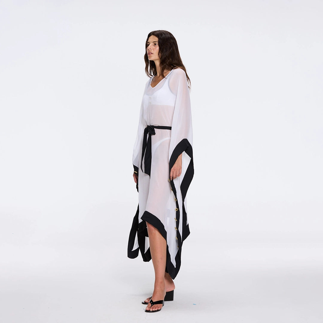 Tata White-Black Sheer Gold Buttoned Belted Kaftan with Asymmetric Hem | Moeva | Kaftans | Each week unveils new pieces—luxury swimwear, fluid resort silhouettes, and elevated summer-to-evening essentials designed to carry you from coastal escapes to city nights.