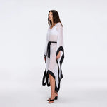 Tata White-Black Sheer Gold Buttoned Belted Kaftan with Asymmetric Hem | Moeva | Kaftans | Each week unveils new pieces—luxury swimwear, fluid resort silhouettes, and elevated summer-to-evening essentials designed to carry you from coastal escapes to city nights.
