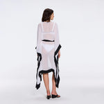 Tata White-Black Sheer Gold Buttoned Belted Kaftan with Asymmetric Hem | Moeva | Kaftans | Each week unveils new pieces—luxury swimwear, fluid resort silhouettes, and elevated summer-to-evening essentials designed to carry you from coastal escapes to city nights.