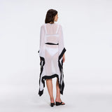 Tata White-Black Sheer Gold Buttoned Belted Kaftan with Asymmetric Hem | Moeva | Kaftans | Each week unveils new pieces—luxury swimwear, fluid resort silhouettes, and elevated summer-to-evening essentials designed to carry you from coastal escapes to city nights.