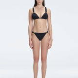 "Model wearing the Zella Black Bikini Top from the front view, featuring a personalized fit with removable padding."
