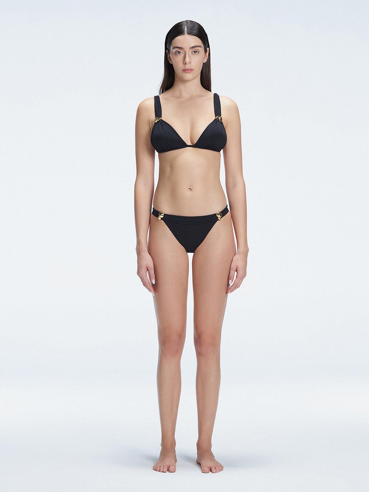 "Model wearing the Zella Black Bikini Top from the front view, featuring a personalized fit with removable padding."
