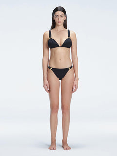 "Model wearing the Zella Black Bikini Bottom from the front view , featuring moderate coverage and a low waist fit."
