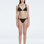 "Model wearing the Zella Black Bikini Set from the front view , featuring moderate coverage and a low waist fit."
