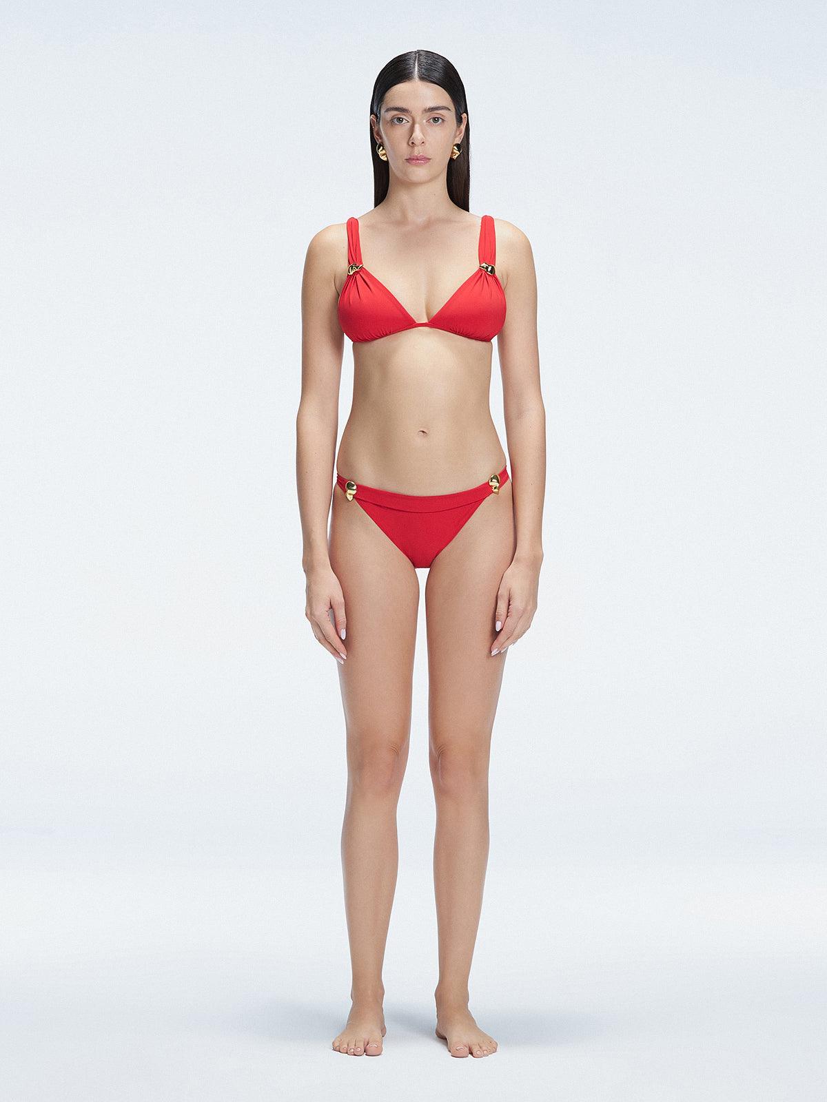 "Model wearing the Zella Red Bikini Bottom from the front view , featuring moderate coverage and a low waist fit."
