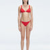 "Model wearing the Zella Red Bikini Bottom from the front view , featuring moderate coverage and a low waist fit."
