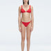 "Model wearing the Zella Red Bikini Set from the front view, featuring a personalized fit with removable padding."
