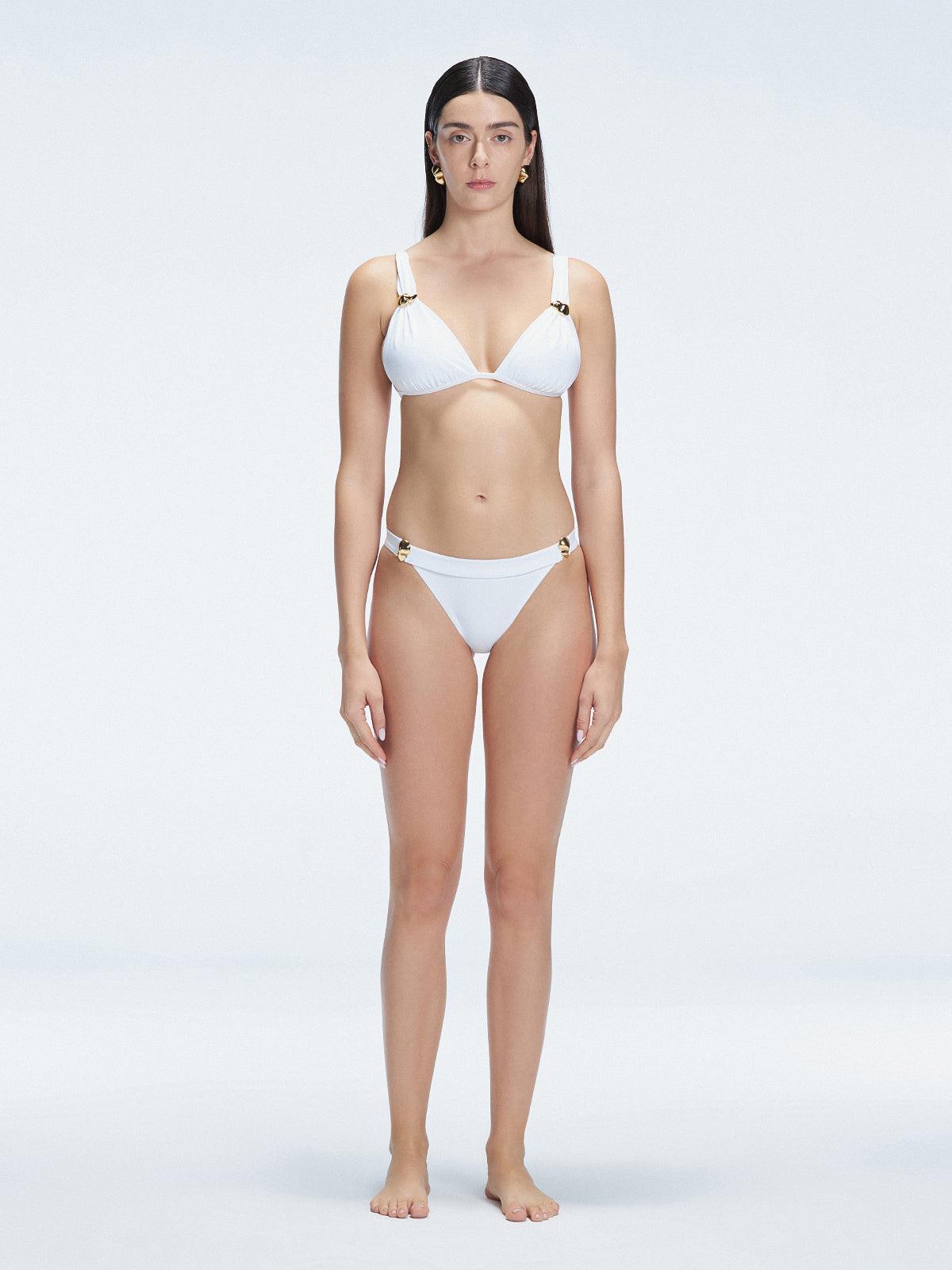 "Model wearing the Zella White Bikini Top from the front view, featuring a personalized fit with removable padding."
