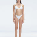 "Model wearing the Zella White Bikini Bottom from the front view , featuring moderate coverage and a low waist fit."
