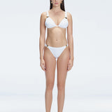 "Model wearing the Zella White Bikini Set from the front view , featuring moderate coverage and a low waist fit."
