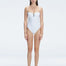 "Model wearing the Zephyrine White Swimsuit from the front view, featuring removable straps and a chic buckle."
