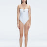 "Model wearing the Zephyrine White Swimsuit from the front view, featuring removable straps and a chic buckle."
