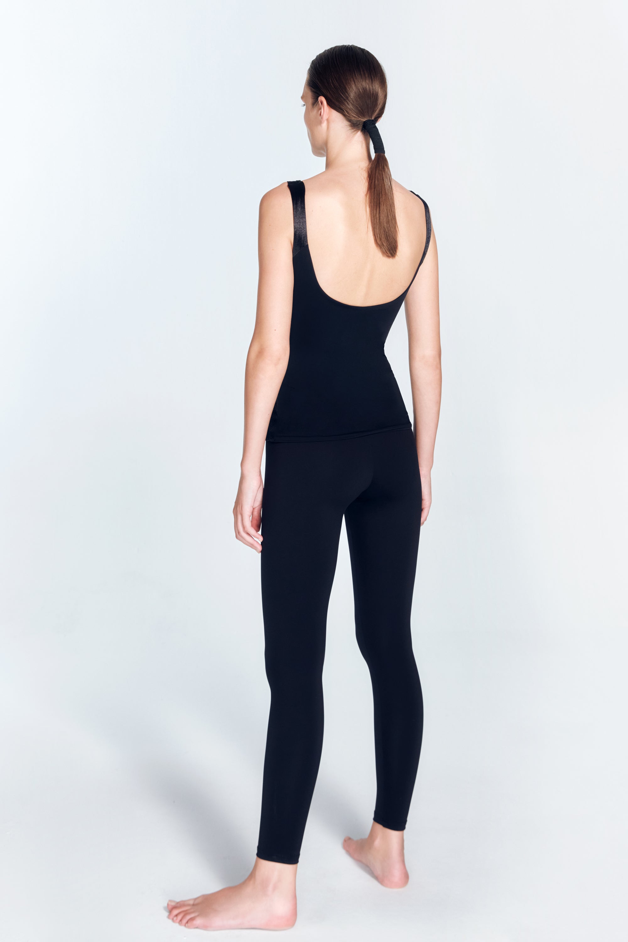 Dulce Black Sport Top | Moeva | Sports Tops | Each week unveils new pieces—luxury swimwear, fluid resort silhouettes, and elevated summer-to-evening essentials designed to carry you from coastal escapes to city nights.
