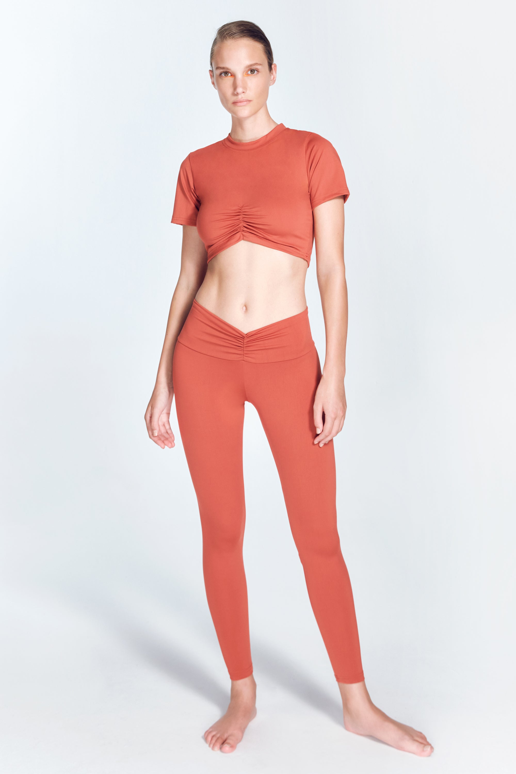 Ida Red Ochre Leggings | Moeva | Activewear | Each week unveils new pieces—luxury swimwear, fluid resort silhouettes, and elevated summer-to-evening essentials designed to carry you from coastal escapes to city nights.