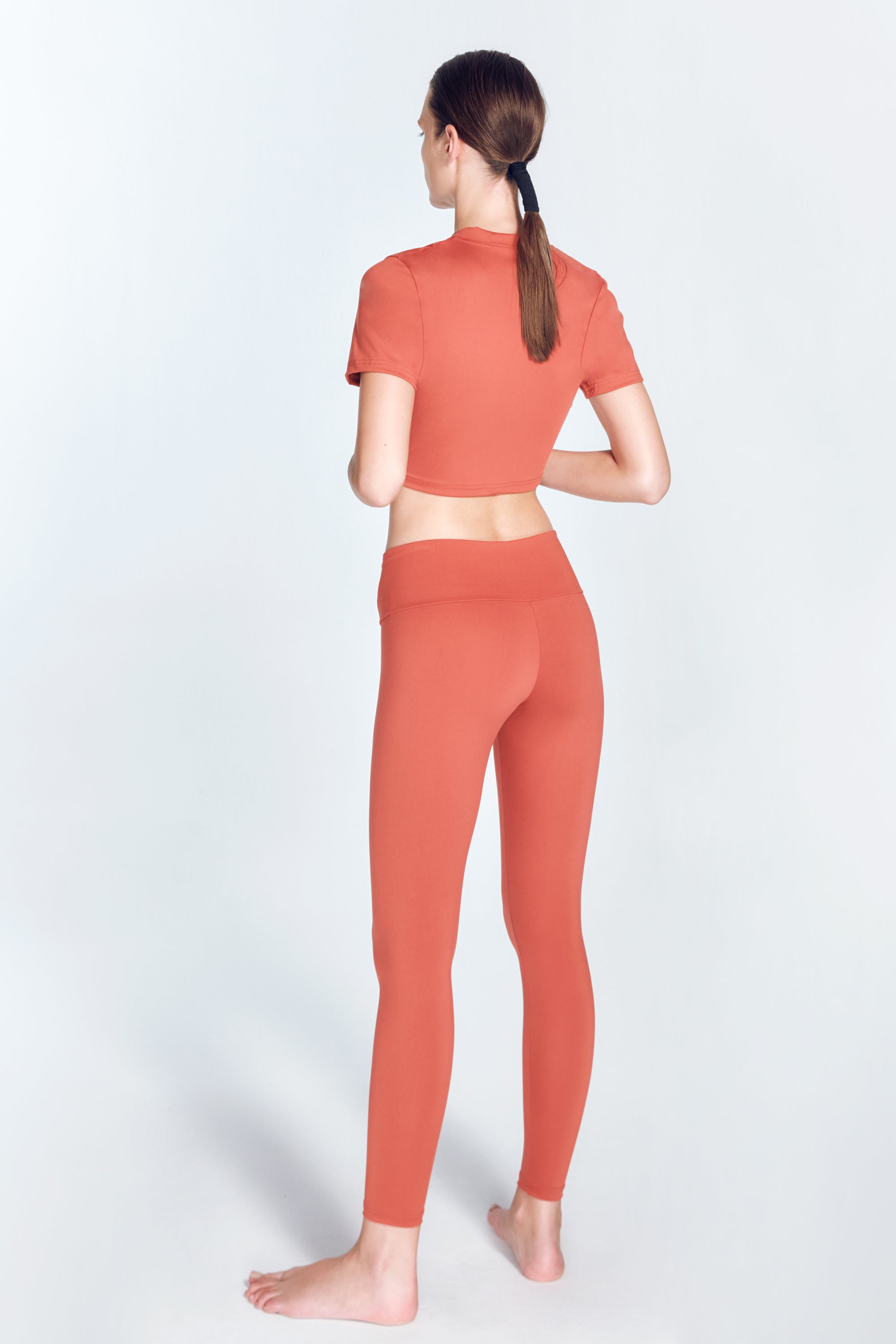 Ida Red Ochre Leggings | Moeva | Activewear | Each week unveils new pieces—luxury swimwear, fluid resort silhouettes, and elevated summer-to-evening essentials designed to carry you from coastal escapes to city nights.