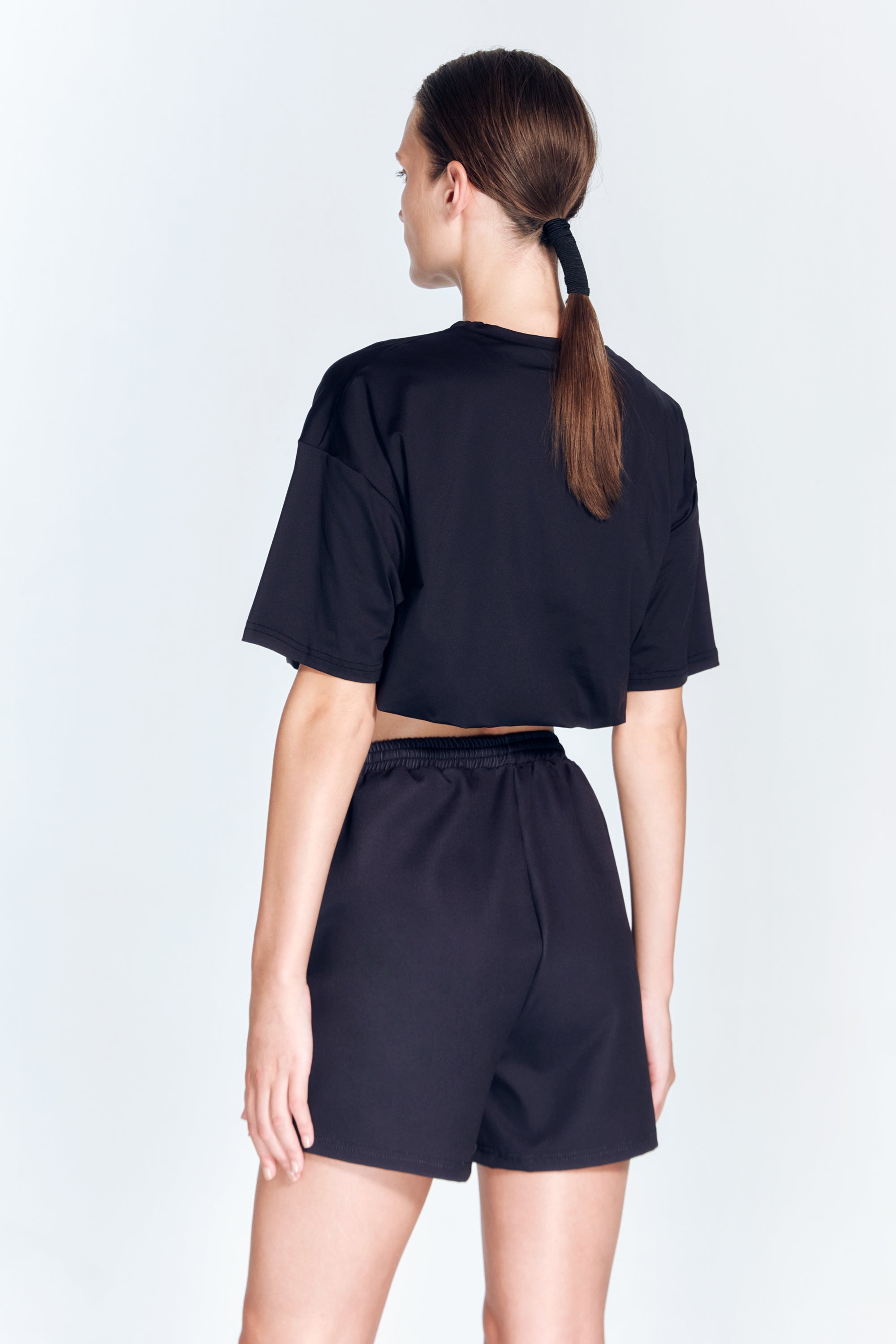 Linette Black Shorts | Moeva | Activewear | Each week unveils new pieces—luxury swimwear, fluid resort silhouettes, and elevated summer-to-evening essentials designed to carry you from coastal escapes to city nights.