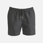 Decoupage image of Louis Dark Grey ultralight men's swim shorts by Moeva, displaying multiple angles and details. Highlighting the sleek design, elastic waistband, drawstrings with black nickel stoppers, and Moeva patch. Ideal for stylish and comfortable beachwear."