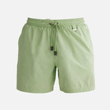 "Decoupage image of Louis mint green mid-thigh length men's swim shorts by Moeva, showcasing multiple angles and details. Highlighting the ultra-light, quick-dry fabric, elastic waistband, drawstrings with black nickel stoppers, Moeva patch, and two open pockets. Perfect for creating a stylish and comfortable beachside look."