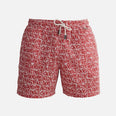 "Decoupage image of Louis red mosaic mid-thigh length men's swim shorts by Moeva, showcasing multiple angles and details. Highlighting the ultra-light, quick-dry fabric, elastic waistband, drawstrings with black nickel stoppers, Moeva patch, and two open pockets. Perfect for creating a stylish and comfortable beachside look."