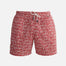 "Decoupage image of Louis red mosaic mid-thigh length men's swim shorts by Moeva, showcasing multiple angles and details. Highlighting the ultra-light, quick-dry fabric, elastic waistband, drawstrings with black nickel stoppers, Moeva patch, and two open pockets. Perfect for creating a stylish and comfortable beachside look."