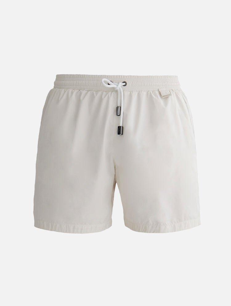  "Decoupage image of Louis white mid-thigh length men's swim shorts by Moeva, showcasing multiple angles and details. Highlighting the ultra-light, quick-dry fabric, elastic waistband, drawstrings with black nickel stoppers, Moeva patch, and two open pockets. Perfect for creating a stylish and comfortable beachside look."