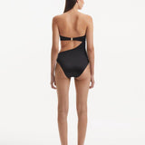 Marilla Black Gigi Black Swimsuit Back View: Sleek black one-piece swimsuit with a high-cut leg and halter neckline. The design emphasizes a streamlined silhouette with minimal bottom coverage and premium Italian fabric.