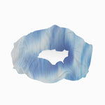 Peggy Blue Degraded Scrunchie laid flat, displaying the soft texture and stretchy swimwear fabric.
