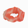 Peggy Red Degraded Scrunchie laid flat, showcasing the vibrant red gradient and soft swimwear fabric.
