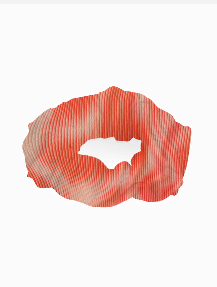 Peggy Red Degraded Scrunchie laid flat, showcasing the vibrant red gradient and soft swimwear fabric.
