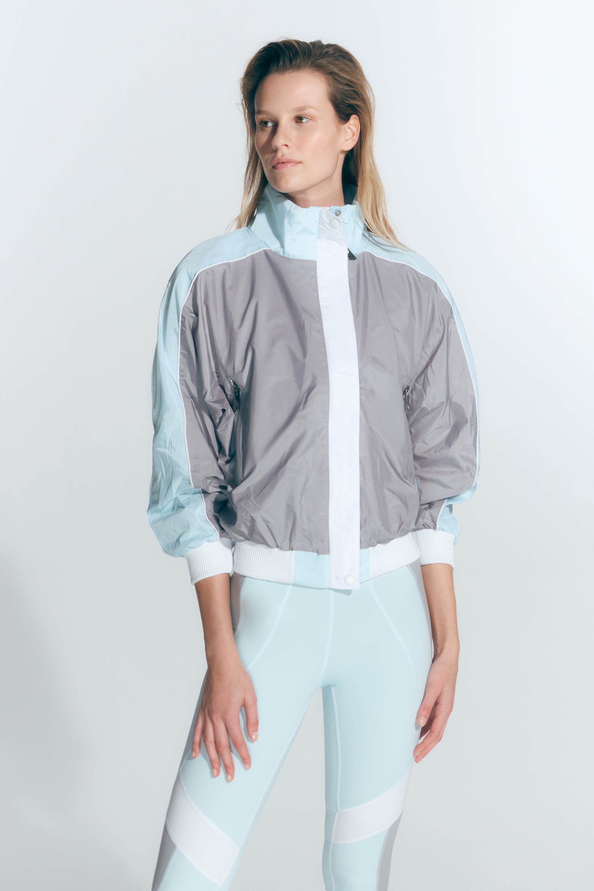 Pixie Green/Grey/White Jacket | Moeva | Activewear | Each week unveils new pieces—luxury swimwear, fluid resort silhouettes, and elevated summer-to-evening essentials designed to carry you from coastal escapes to city nights.