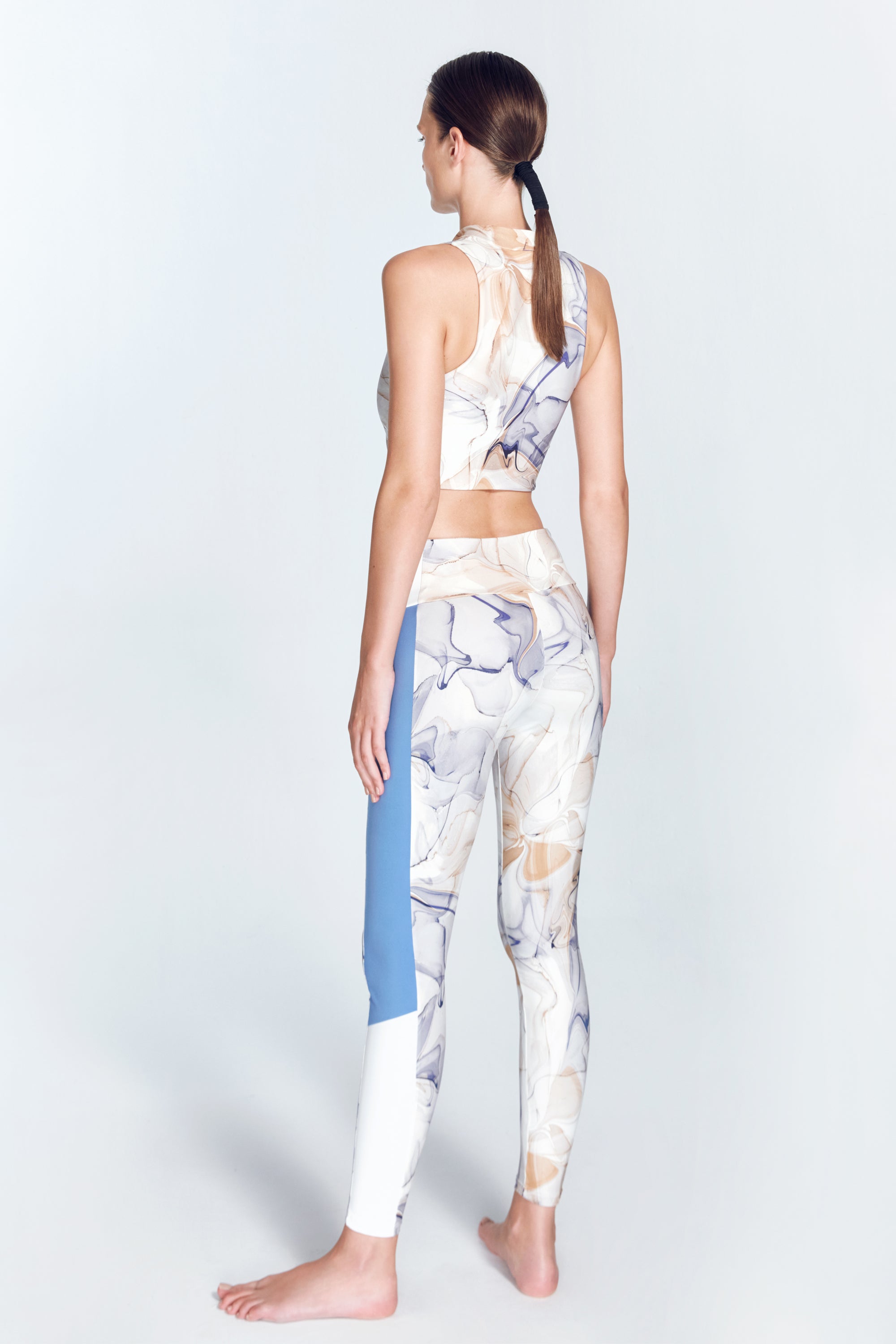 Colombe Blue Abstract Leggings | Moeva | Activewear | Each week unveils new pieces—luxury swimwear, fluid resort silhouettes, and elevated summer-to-evening essentials designed to carry you from coastal escapes to city nights.