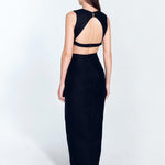 "Back view of Adelice black dress featuring an open back with side cutouts, showcasing a flirty and feminine silhouette."
