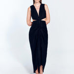 " Front view of Adelice black dress with a deep V neckline, center ruching, asymmetrical skirt, high front slit, and side cutouts."