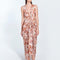 " Front view of Adelice floral abstract dress with deep V neckline, center ruching, asymmetrical skirt, high front slit, and side cutouts."