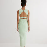 "Back view of the Adelice Mint Green Dress showing the open back and side cutouts that enhance the silhouette."